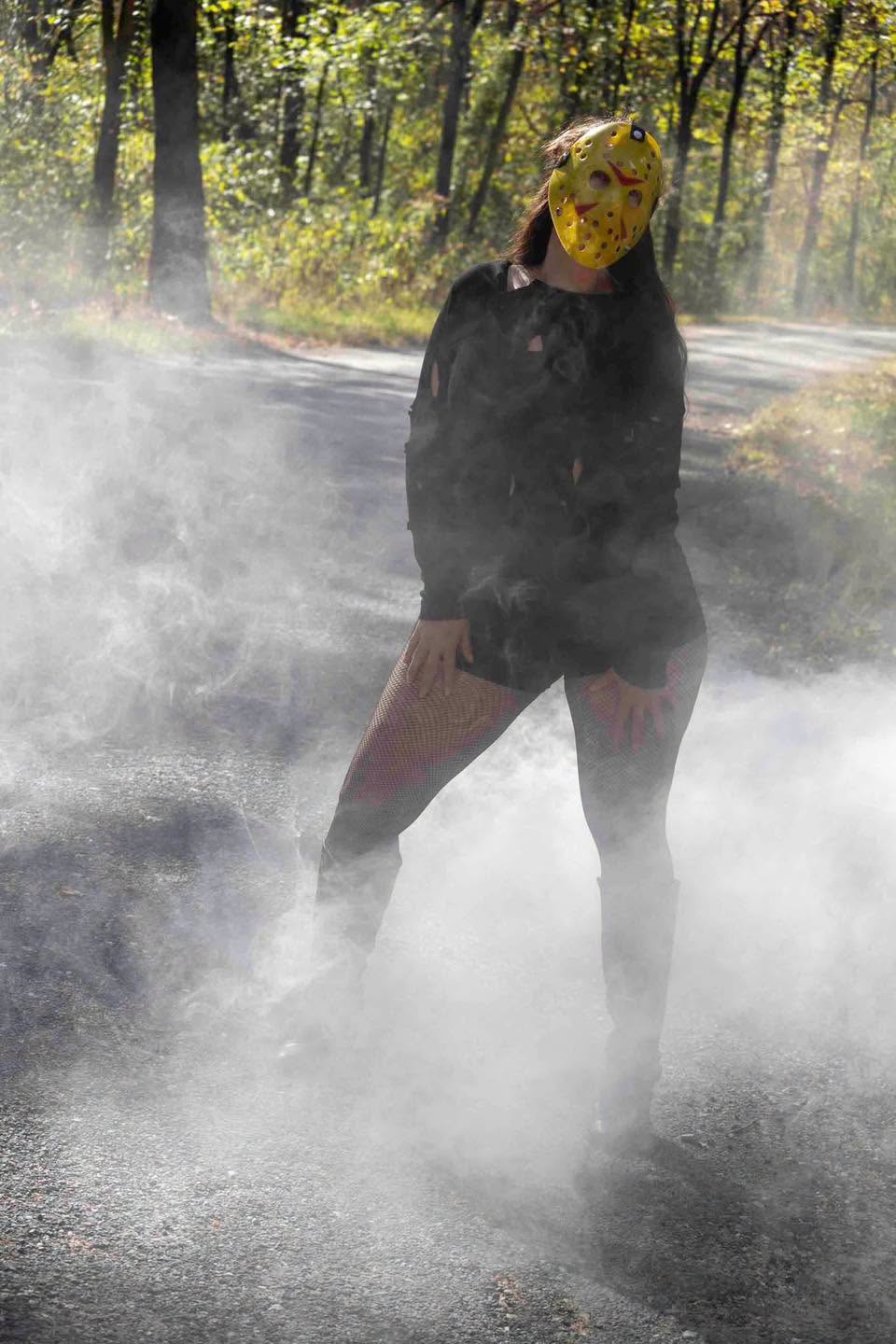 Halloween-themed creative portrait surrounded by fog
