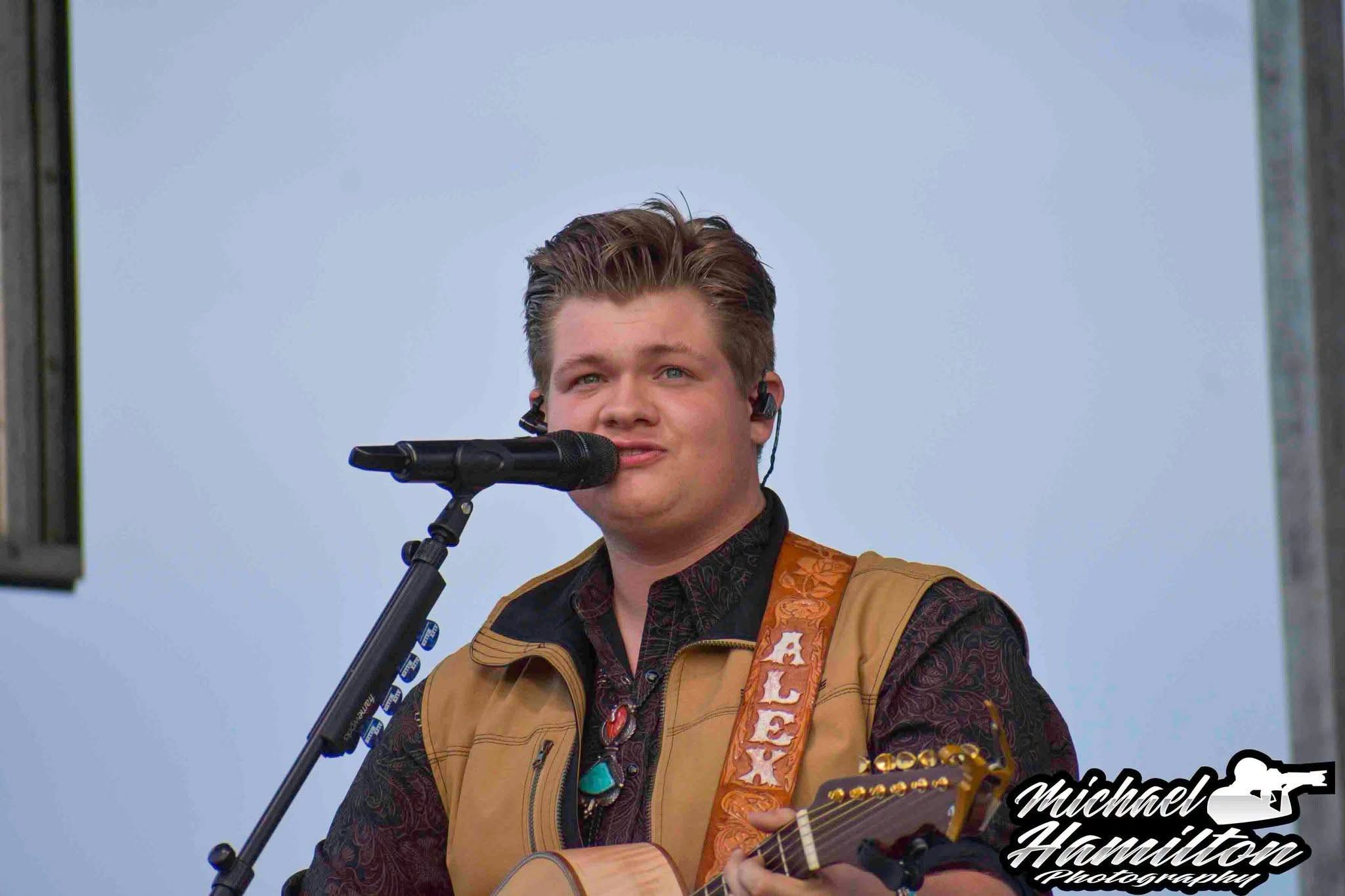 Alex Miller performing on stage